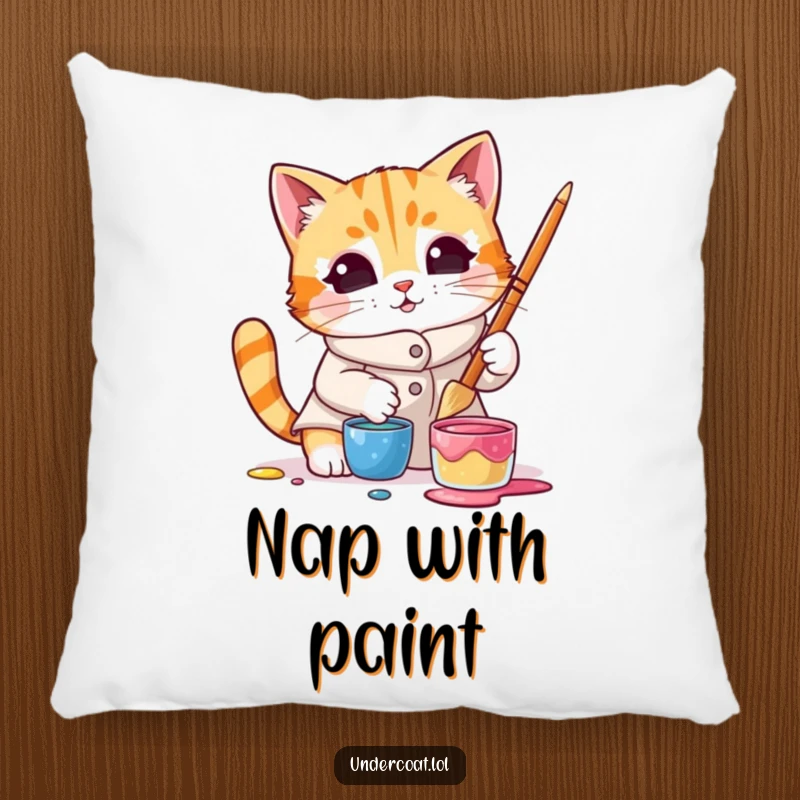 Funny pillow with a curious cat wearing a smock and dipping a brush into paint, perfect for adding cozy, humorous charm.